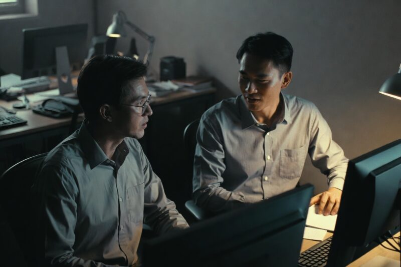 A calm office hallway with soft gray lighting, symbolizing trust and balance.